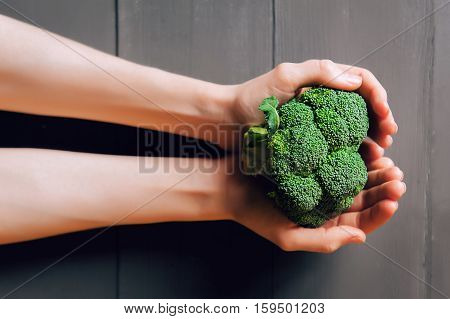 Broccoli In Hands.