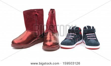 black shoes for son and red ones for mom on white as filiation concept