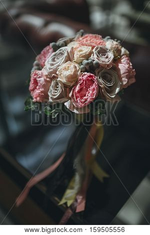 beautiful pink bridal flower bouquet with ribbons