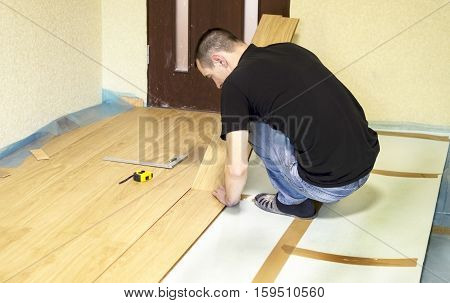 The Process Of Installing Laminate Wooden On The Floor
