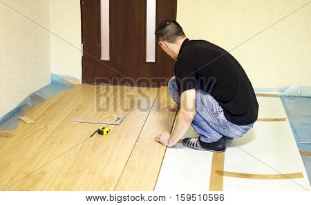 The Process Of Installing Laminate Wooden On The Floor