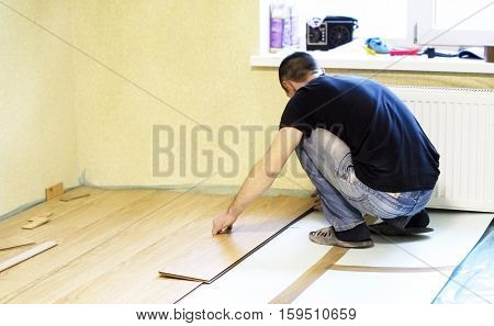 The Process Of Installing Laminate Wooden On The Floor