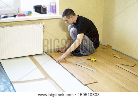 The Process Of Installing Laminate Wooden On The Floor