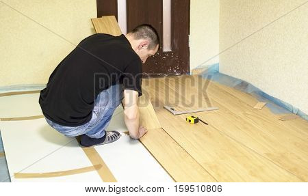 The Process Of Installing Laminate Wooden On The Floor