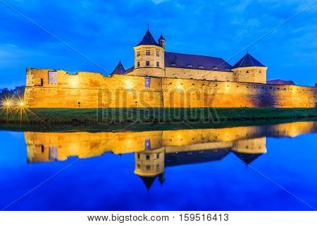 Fagaras, Romania. Medieval fortress of Fagaras at twilight.