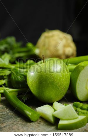 Green vegetables and fruits - celery shoots and apples healthy fitness diet concept