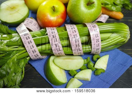 Green vegetables and fruits - celery shoots and apples healthy fitness diet concept