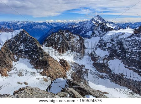 View from Mt. Titlis in the Swiss Alps. Mount Titlis is a mountain, located on the border between the Swiss Cantons of Obwalden and Bern.