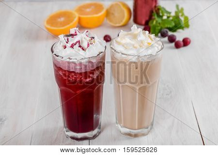 Milkshake shot close-up on a wooden background in the decoration