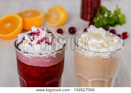 Milkshake shot close-up on a wooden background in the decoration