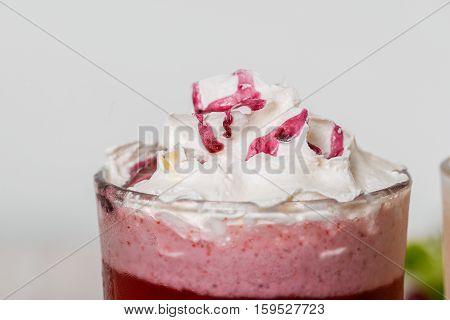 Milkshake shot close-up on a wooden background in the decoration