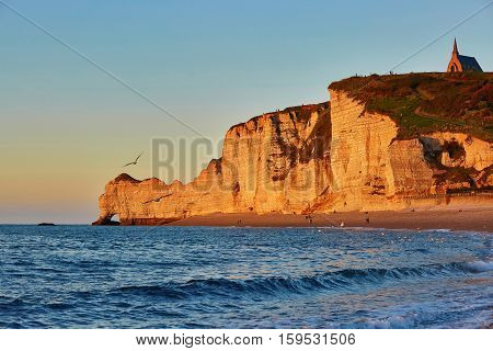 Scenic View Of Etretat Cliffs At Sunset