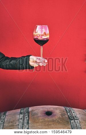 Winemaker Getting Sample Of Red Wine From Barrel.
