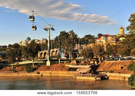 TBILISI GEORGIA - SEPTEMBER 27: View of the riverside and cable car in Tbilisi city centre Georgia on September 27 2015. Tbilisi is the capital and largest city of Georgia.