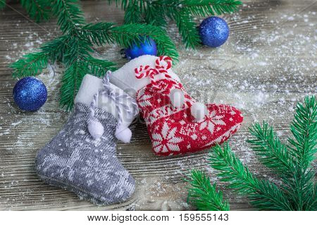 Christmas Stockings On Snowbound Wooden Background With Blue Balls Ornaments