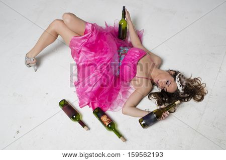 A brunette female is passed out after a night of drinking