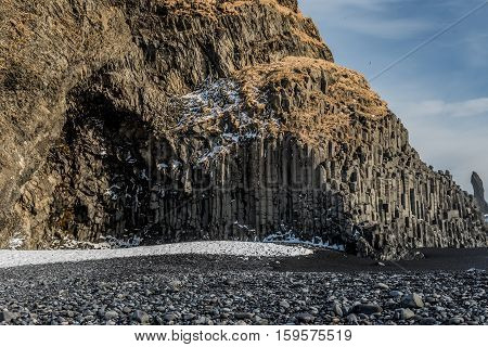 Reynisdranger, sea stacks under the mountain Reynisfjall