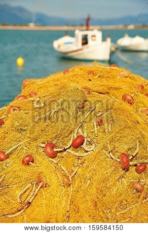 Pile Of Yellow Fishing Nets In Port