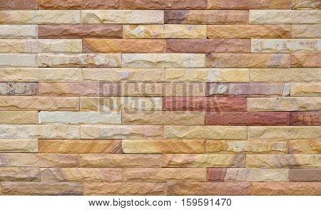 Exterior sandstone Brick Wall texture background pattern color