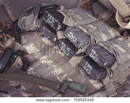 the tactical bulletproof vest with M4 magazines selective focus