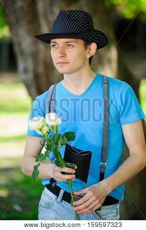 trendy guy with flowers and gift ashion