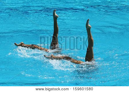 RIO DE JANEIRO, BRAZIL - AUGUST 15, 2016: Huang Xuechen and Sun Wenyan of team China compete during synchronized swimming duets free routine preliminary of the Rio 2016 Olympic Games