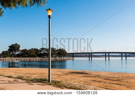Vacation Isle Park Lamppost with Mission Bay and Ingraham Street bridge in the background.