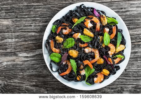Black Noodles Salad With Prawns, Mussels, Spinach, Lettuce, Arugula