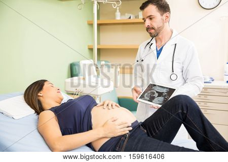Doctor Giving News To Pregnant Woman