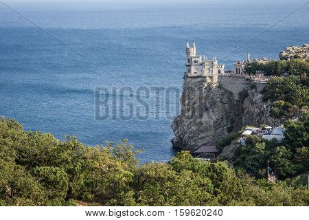 The decorative Neo-Gothic castle Swallow's Nest on the rock over the Black Sea. Gaspra. Crimea