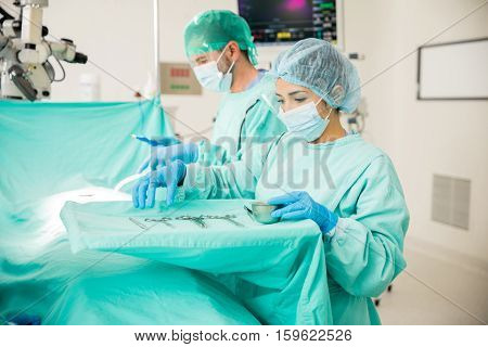 Surgical Instrumentist Working In A Hospital
