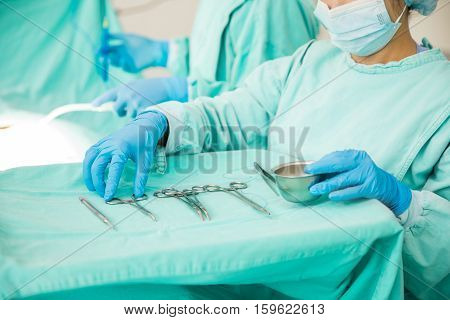 Closeup Of Surgical Instrumentist At Work