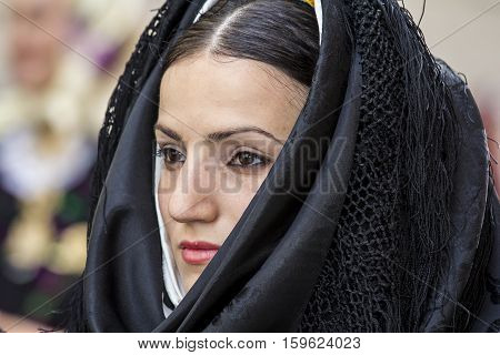 CAGLIARI, ITALY - May 1, 2014: 358 Religious Procession of Sant'Efisio - Sardinia - portrait of a beautiful girl in traditional Sardinian costume