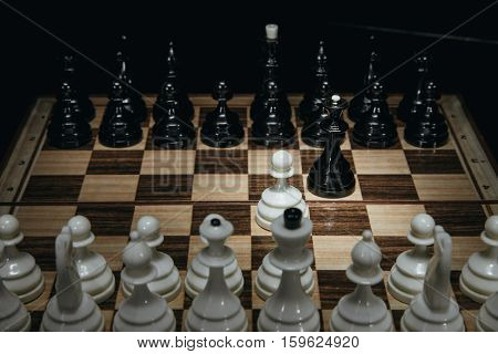 white pawn isolated on background chess pieces
