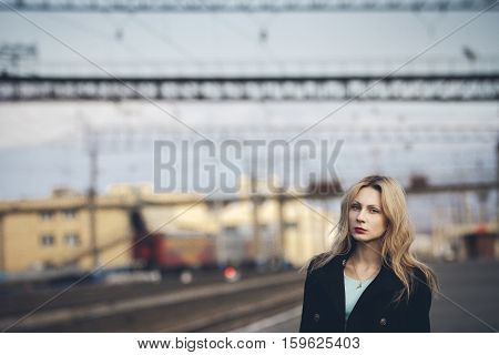 Beautiful Blonde Girl Waiting For The Train At The Station. Romantic, Delicate Look