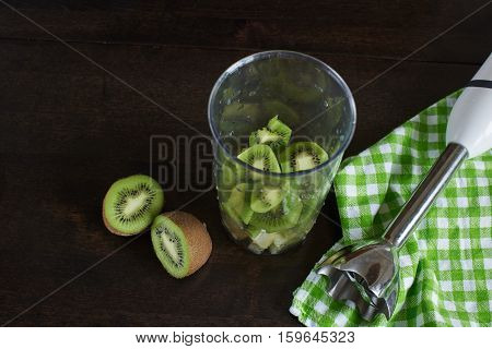 slices of kiwi fruit in a blender