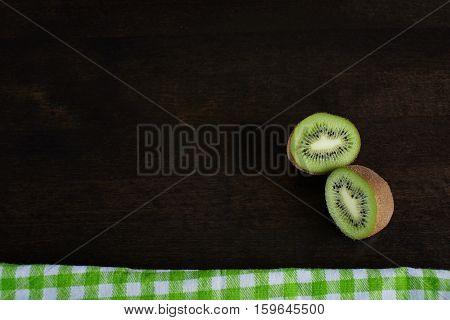 slices of kiwi on a dark background