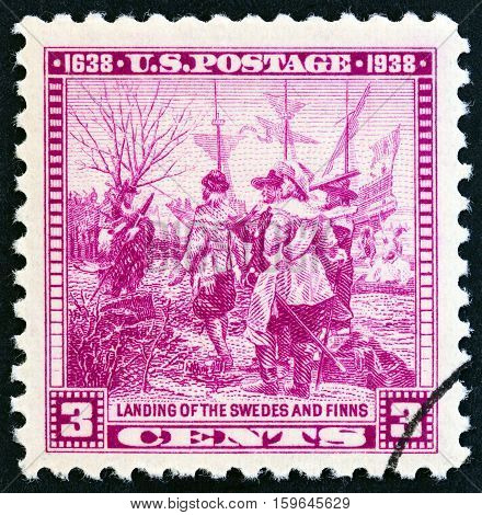 USA - CIRCA 1938: A stamp printed in USA issued for the The 300th anniversary of Swedish-Finnish settlers shows Landing of the Swedes and Finns from Calmare Nyckel (after Stanley Arthurs), circa 1938.