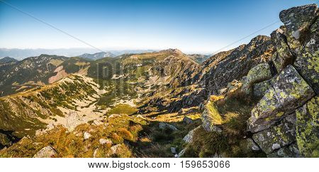 Valley and Mountain Landscape. Under Chopok Mount with Rocks in Foreground and Dumbier Mount in Background. Low Tatras Slovakia.