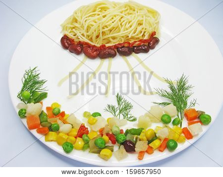 creative spaghetti food garnish with sausage meduse form