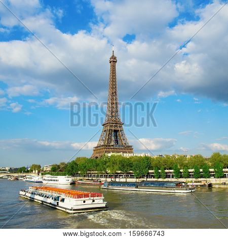 Eiffel Tower With Touristic Boat On Seine