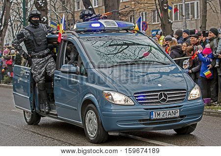 TIMISOARA ROMANIA - DECEMBER 1 2016: Military parade at Romanian National Day. Cops simulating a mission. Picture is taken in front of the Administrative Palace in Timisoara.