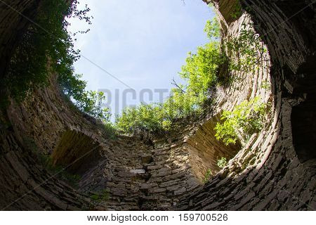 Overgrown With Bushes And An Old Stone Fortress Of Koporye