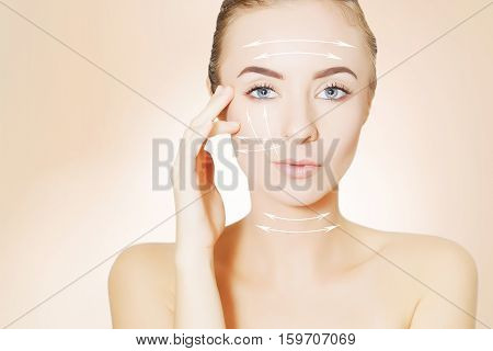 Closeup of female adult with  marks on skin for cosmetic medical procedures