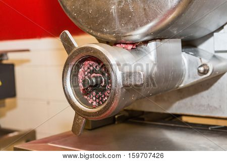 Meat grinder butcher shop minced meat. Mincing machine.