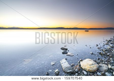 Lake stone and rock during sunrise moment