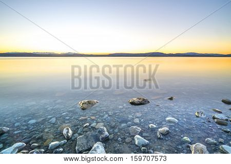 Lake stone and rock during sunrise moment