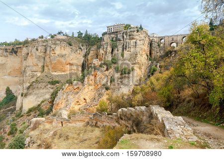 The unique stone bridge across the gorge in the village Ronda. Spain. Andalusia.