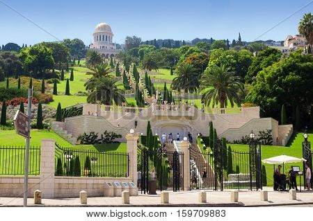 HAIFA ISRAEL - CIRCA SEP 2016: Bahai Gardens. Tourists walk on the terrace. View from the lower gate