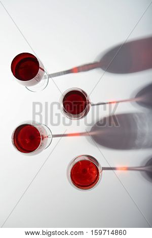 red wine tall glasses with stems isolated on white background view from top